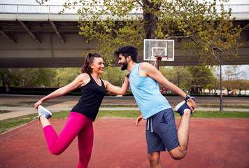 Active fitness couple exercising together outdoor