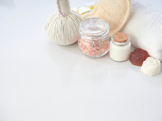 Set of spa accessories on a white table