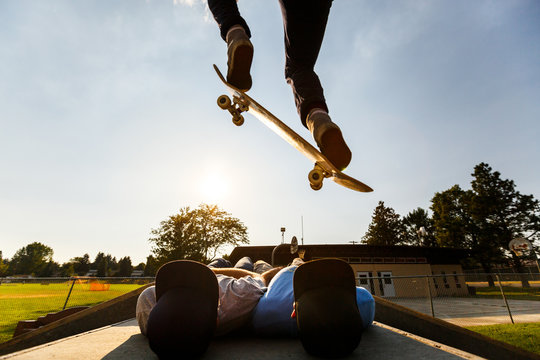Sibling trust exercise. Alec Engerbretson jumps his brothers, James (left) and Ian, at a skate park in north Idaho.