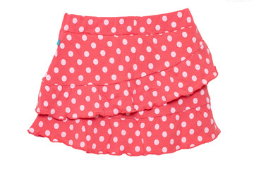 Summer skirt isolated. Closeup of a beautiful red little girl short polka dot skirt isolated on a white background. Children and kids fashion. Macro. © Olga