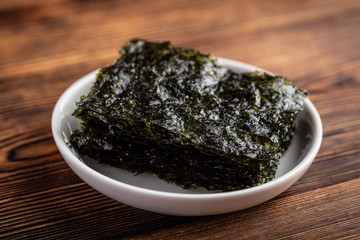 korean roasted seaweed on wooden background