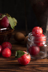 Ripe Plumbs with Jam Making Equipment on a Kitchen Table