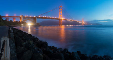 Classic panoramic view of famous Golden Gate Bridge seen from San Francisco harbour in beautiful...
