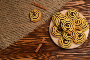 Home made baked cookies with raisins and poppy seeds. Space for text or design.