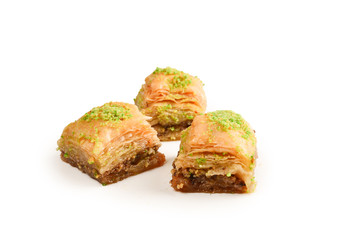 Pistachio baklava on a white background. Dessert.