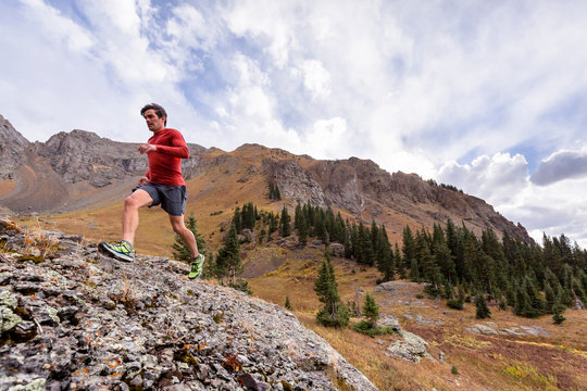 Gold King Basin, near Telluride, Colorado, USA: A male runner running the alpine trails at the Gold King Basin.