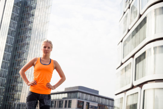 European Quarter, Stuttgart, Baden-W&cedil;rttemberg, Germany: A famele runner after her morning run through the city.