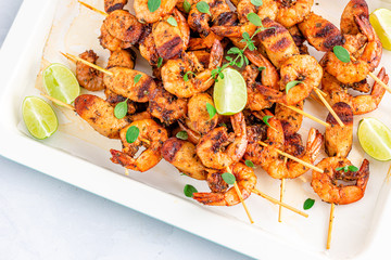 Grilled Shrimp Kebab on Skewers Horizontal Photo. Shrimp / Prawn Roasted Garnished with Oregano and Lemon.