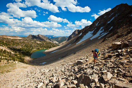 A woman makes the descent from the chossy Devil's Staircase, a shortcut to get from Born Lakes to the Boulder Chain Lakes on the otherside of the pass in the White Cloud Mountains in Idaho.