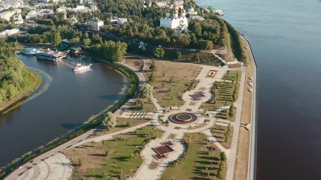 Scenic aerial view of famous Strelka park in place of confluence of Kotorosl and Volga rivers in ancient touristic historic town Yaroslavl in Russian Federation. Beautiful summer sunny look of park