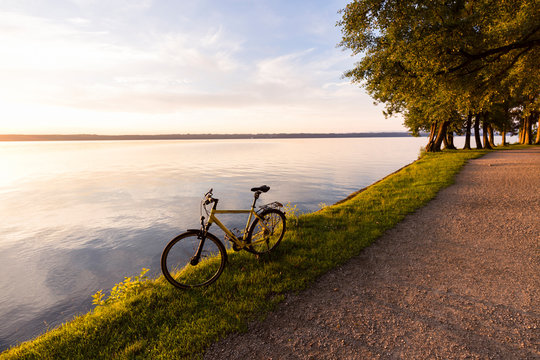 Tutzing at Lake Starnberg, Bavaria, Germany: A bike at the lake during sunrise.