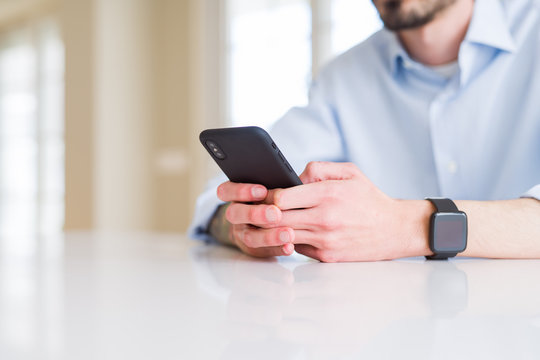 Close up of business man working using smartphone