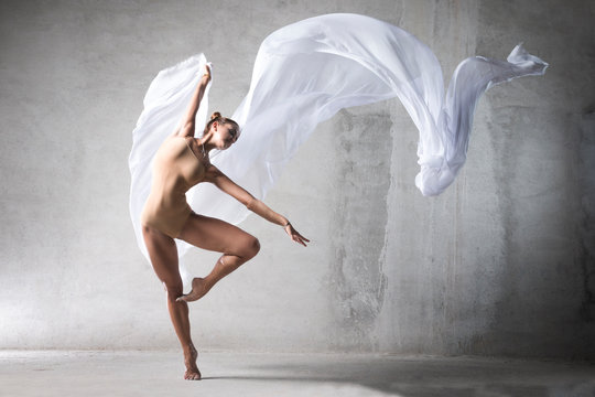 Naklejka ballet dancer in the work, the dancer with a cloth, a girl with a beautiful body, elegantly girl, graceful woman, lady in dance, athletic body, time show, the girl in flight, wite silk in air, girl,