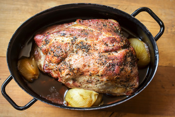 Roast pork shoulder with onion 