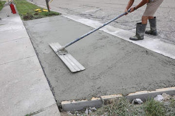 concrete work is being performed at a home in a urban neighborhood © Ron Alvey