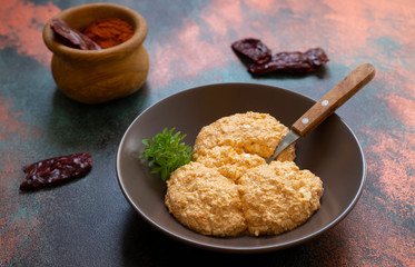Serbian salad called Urnebes of cheese and chili peppers, paprika powder, chopped peppers and dry peppers (aleva). Traditional Serbian appetizer. Serbian cuisine