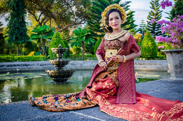 Beautiful Bali girl dress posing in beautiful nature place in Bali