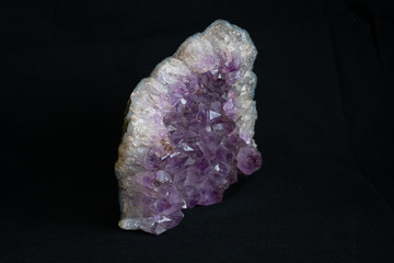Part of big geode found in europe white and purple crystals in the inside