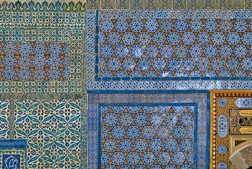 Classical oriental design detail on tiled wall at Topkapi Palace in Istanbul, Turkey.