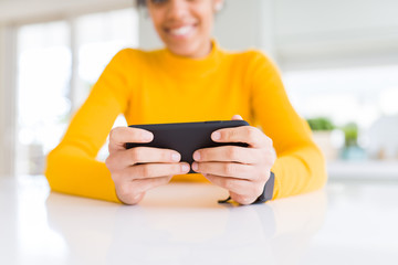 Close up of young african woman using smartphone