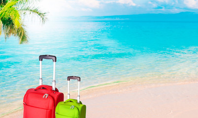 suitcases and travel luggage with the beach landscape