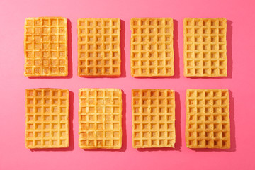 Flat lay composition with belgian waffles on color background