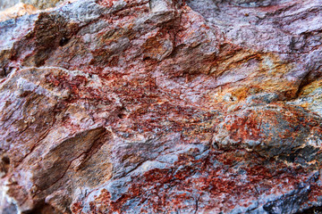 Naklejka premium Texture of a beautiful relief natural stone. Background.