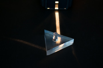 Physics experiment. Demonstration of reflection of light in a prism.