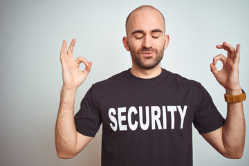 Young safeguard man wearing security uniform over isolated background relax and smiling with eyes...