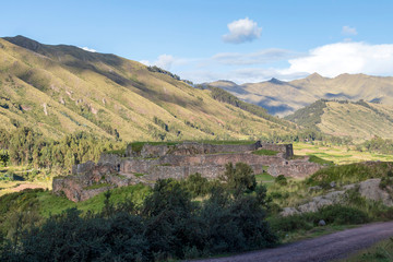 Green mountain landscape with Inca ruins of fortress Puka Pukara, Cusco Region, Peru