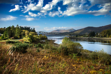 Obraz premium Scenic view of Scottish landscape and Ballachulish Bridge over Loch Leven near Glencoe.