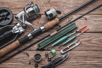 Fishing tackle for fishing peaceful fish. Float, fishing rod, reel, fishing line on the wooden...