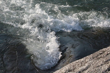 Water hitting stones. © KS