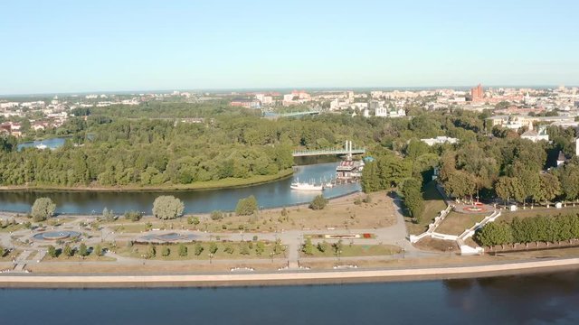 Scenic aerial view of famous Strelka park in place of confluence of Kotorosl and Volga rivers in ancient touristic historic town Yaroslavl in Russian Federation. Beautiful summer sunny look of park