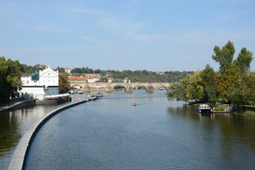 Fototapeta na wymiar Panoramic view of Vltava river and Charles bridge on a bright summer day, in Prague, Czech Republic