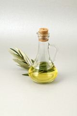 olive oil bottle silver background