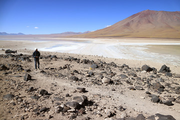 One man visiting Laguna Verde or the Green Lake, a popular destination in Potosi department of Bolivia, South America