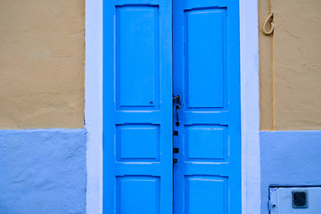Door ajar, architecture detail, Latino district, soft pastel colors.