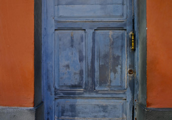 Pale blue and gray door of an old villa house, architecture detail, Latino district.