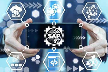 Man holding smartphone with sap micro chip icon on screen. SAP - Business process automation...