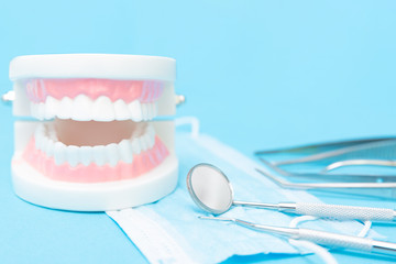 Fototapeta na wymiar Orthodontic teeth model and professional dentist tools on the table in dentist's office