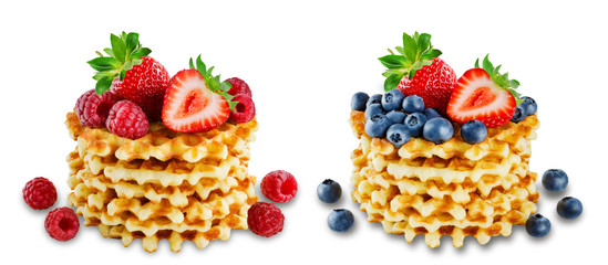 Waffles with fresh berries on a white background