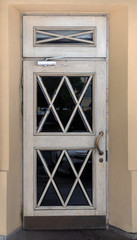 Old white doors with glass windows