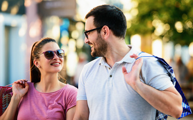 Young couple in shopping. Consumerism, love, dating, lifestyle concept