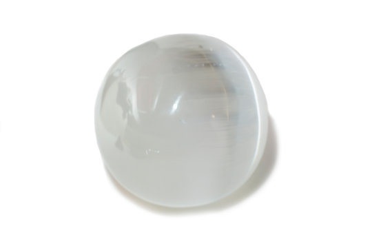 Beautiful white selenite sphere, cut mineral on white background, isolated