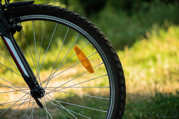 Naklejka premium back wheel of bicycle, sport technic, action is life, green nature