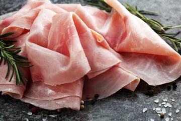 Fotobehang Sliced ham on wooden background. Fresh prosciutto cotto. Pork ham sliced. © beats_