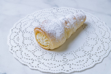 Tube with cream desert on white