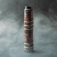 Vape device in vapor smoke clouds, stylish mechmod with RDA atomizer for vaping, close up