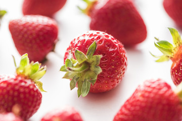 selective focus of ripe and red strawberries on white background